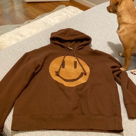 brown hoodie with smiley face